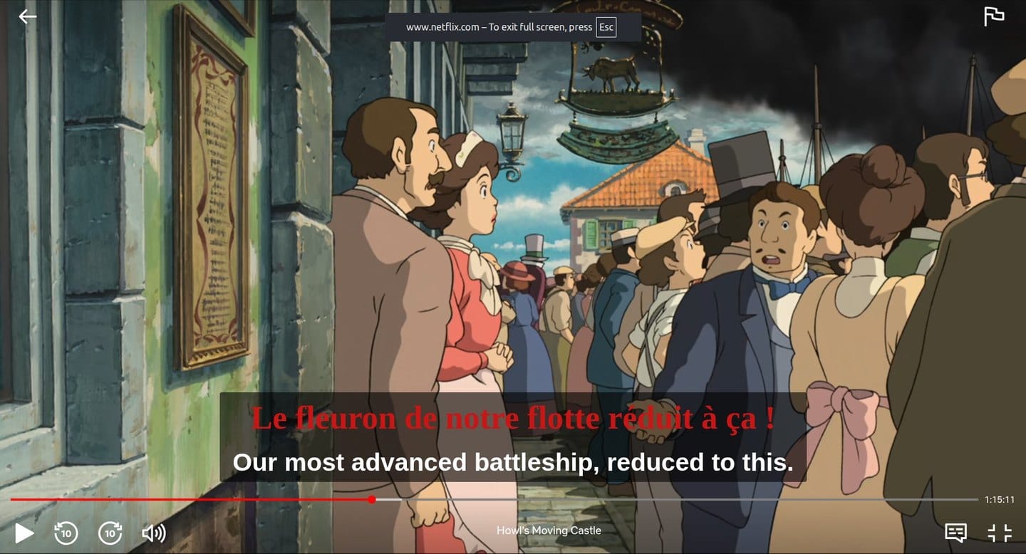 The same scene in full screen with the controls showing: the dual subtitles scale up and still sit clear above the progress bar.